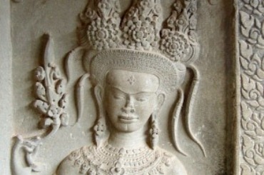 Close-up of a bas-relief of an Angkor dancer wearing an ornate headdress and jewellery