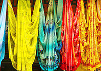 Brightly coloured scarves and tapestries