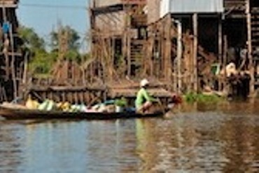 Man on boat selling goods