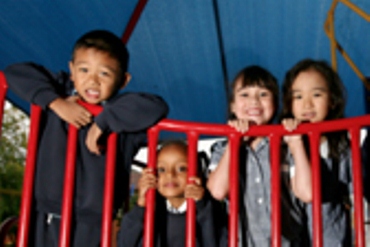 Four children play on a playground