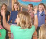 Group of students playing a game in classroom