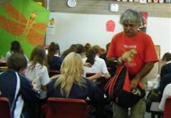 Duncraig teacher distributing materials to students