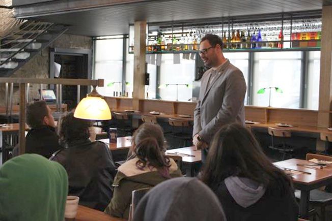 Andre Bishop disscusses with students at Kumo Izakaya restaurant